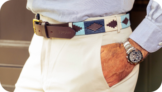 A blue and cream handstitched pampeano belt sported with monochrome men's outfit 