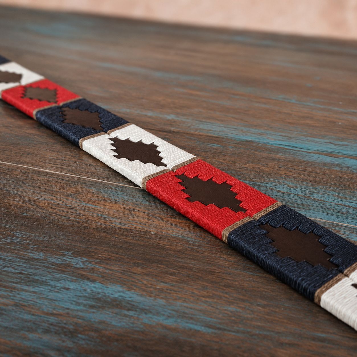 Bespoke leather belt design displayed on a table, also available in personalised leather belts, dog collar & lead 