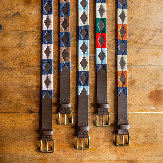 five bestselling pampeano belts displayed together, featuring signature designs crafted from full-grain leather
